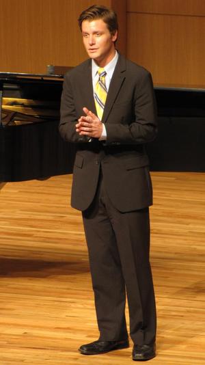 [Close-up of singer wearing a yellow tie at the Student recital during Jake Heggie's residency, 7]