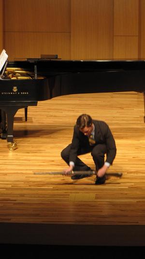[Close-up of singer wearing a yellow tie at the Student recital during Jake Heggie's residency, 9]