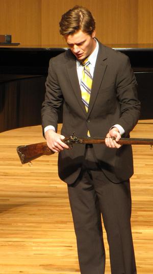 [Close-up of singer wearing a yellow tie at the Student recital during Jake Heggie's residency, 11]