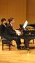 Photograph: [Close-up of Heggie playing the piano at the Student recital during J…