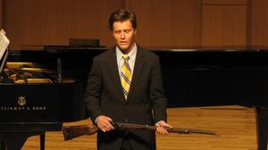 [Close-up of singer wearing a yellow tie at the Student recital during Jake Heggie's residency, 15]