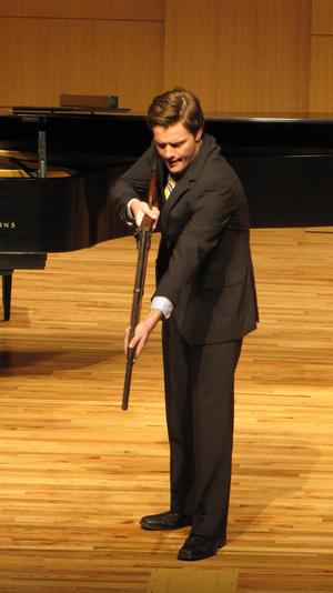 [Close-up of singer wearing a yellow tie at the Student recital during Jake Heggie's residency, 21]