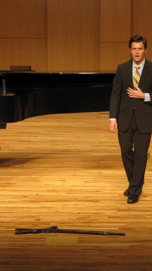 [Close-up of singer wearing a yellow tie at the Student recital during Jake Heggie's residency, 25]