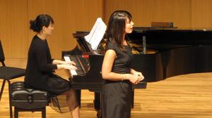 [Close-up of singer wearing a black dress at the Student recital during Jake Heggie's residency]