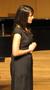 Photograph: [Close-up of a singer wearing a black dress at the Student recital du…