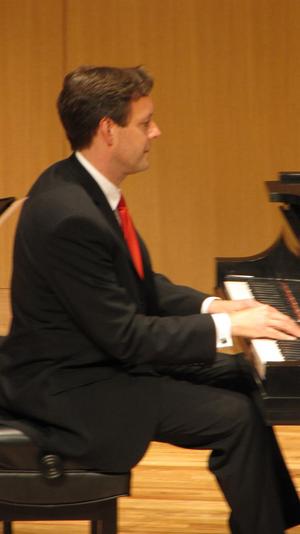 [Close-up of Heggie playing piano, Student recital during Jake Heggie's residency]