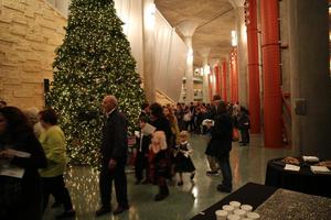 [Guests and Christmas tree in foyer at Sounds of the Holidays]