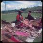 Primary view of [Two Women Selling Clothing at a Market]