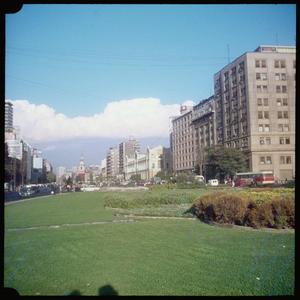Primary view of object titled '[Trimmed grass and multiple buildings in Santiago]'.