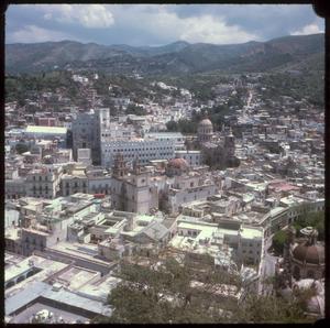 [Aerial view of a city and mountains, 1]