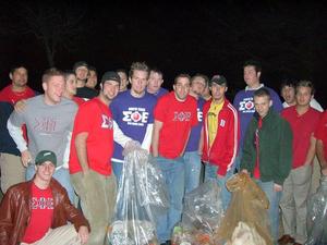 [Sigma Phi Epsilon members pose with collected trash]