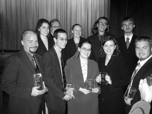 [Moot Court team poses with awards]