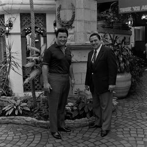 [Two men posing at a courtyard #2]