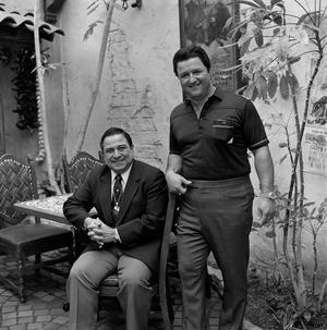 [Two men posing at a courtyard #6]