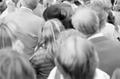 Photograph: [The backsides of a large crowd]