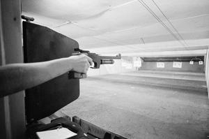 Primary view of object titled '[An individual at a shooting range #1]'.