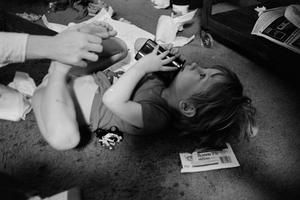 [A child laying on the floor #1]