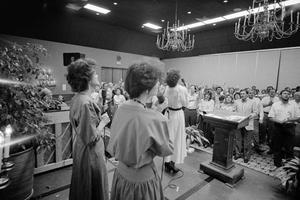 [Women lead churchgoers in song, 3]