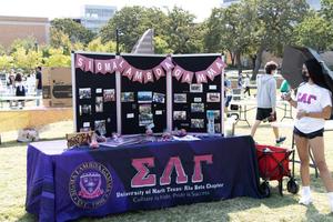 [Table and poster board from Sigma Lambda Gamma National Sorority]