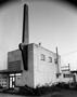 Photograph: [A building with a tall sign in Mansfield]