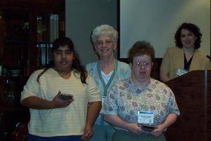Primary view of object titled '[Hope Martinez and Raydene Brown with Lillie at 2003 CPS training event]'.
