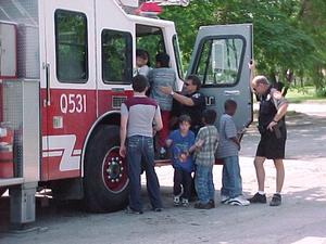 [Children explore fire engine at ILD event]