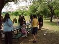 Photograph: [ILD attendees converse around picnic tables]