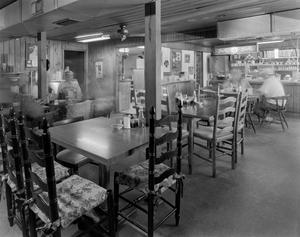 [Interior of a Restaurant and People Dining]