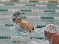 Photograph: [UNT and NMSU competitors race in breaststroke event]