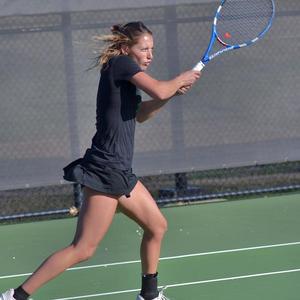 Primary view of object titled '[Augustina Valenzuela swings racket backhanded during TCU match]'.