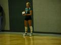 Photograph: [Ashley Bass prepares to serve volleyball]