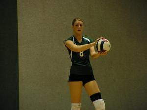 [Katy Prokof prepares to serve volleyball]