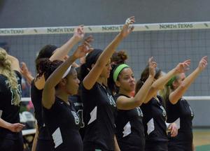 [UNT volleyball players do eagle claw during match]