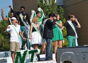 Primary view of object titled '[Homecoming Court rides float at 2012 Homecoming Parade]'.