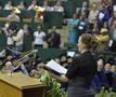 Photograph: [Woman sings at UNT Fall 2011 Commencement]