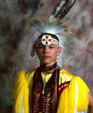 [An Indigenous American in traditional powwow clothing, 2]