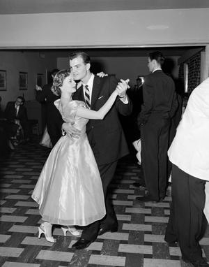 [Larry Alvin Crabbe Jr. dancing with an unidentified woman]