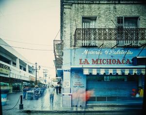 [La Michoacán store at the entrance to a market area in color]