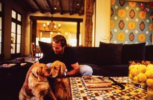 [Mike Modano trying to wrangle his dogs for a portrait]