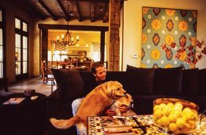 [Mike Modano struggling with his two dogs]
