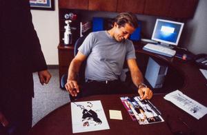 [Mike Modano seated behind his office desk]