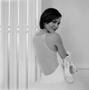 Photograph: [Women posing in a white dress holding Vanessa Noel heels]