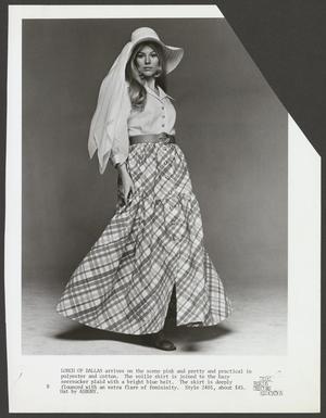 Primary view of object titled '[A woman posing in a voille shirt and flounced skirt]'.