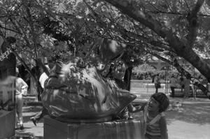 [Two girls viewing a hippo head statue at Six Flags Over Texas in Arlington]