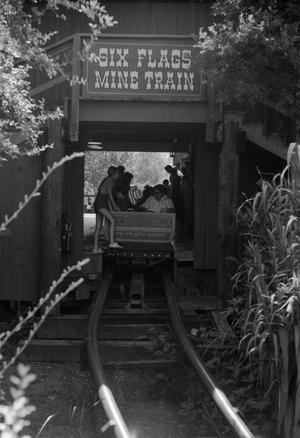 [People crowded around the Mine Train amusement ride at Six Flags Over Texas in Arlington]