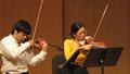 Photograph: [Hao Miao and Thao Huynh perform String Quartet No. 10, "Harp," Op. 7…