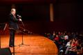 Photograph: [Jay Saunders speaks during "Sounds of the Holidays"]