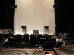 Primary view of object titled '[Sound boards sitting on tables behind rows of chairs]'.