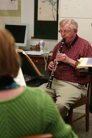 [John Scott playing a clarinet near Kathleen Reynolds]