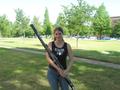 Photograph: [A woman in a black tank top shirt posing with a bassoon, 2]